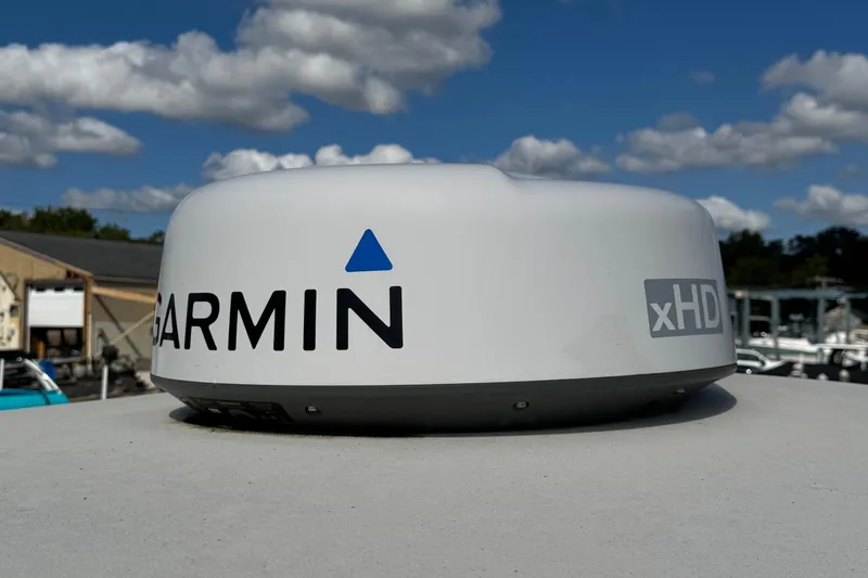 Slide: The Image of Garmin xHD radar on 2011 Parker 2510 XL Walkaround boat under blue sky. - 13