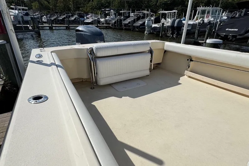 Slide: The Image of 2011 Parker 2510 XL Walkaround boat with spacious deck at marina. - 9