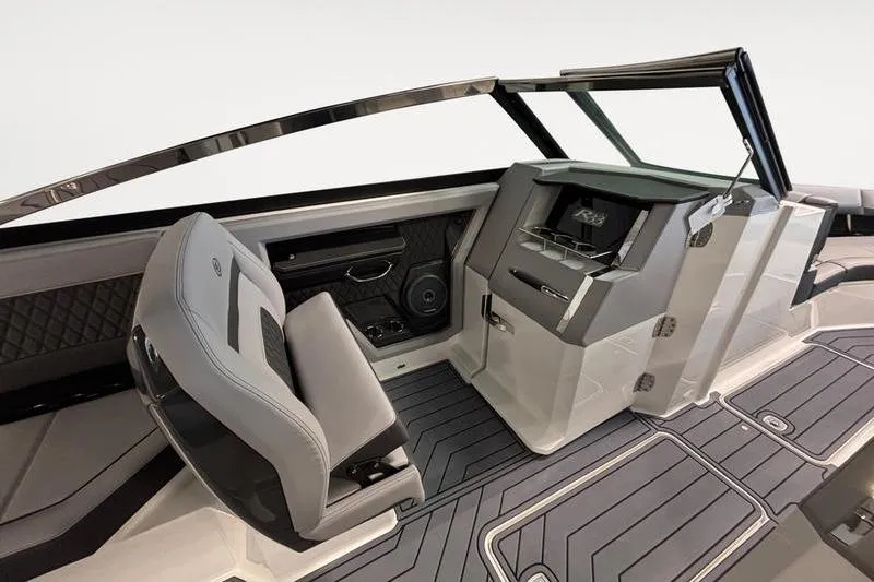 Slide: The Image of Interior of 2026 Cobalt R33 boat with modern dashboard and seating. - 13