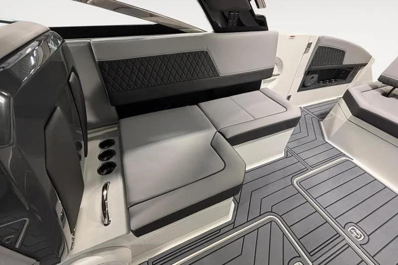 Slide: The Image of 2026 Cobalt R33 boat interior with sleek gray seating and modern design elements. - 14