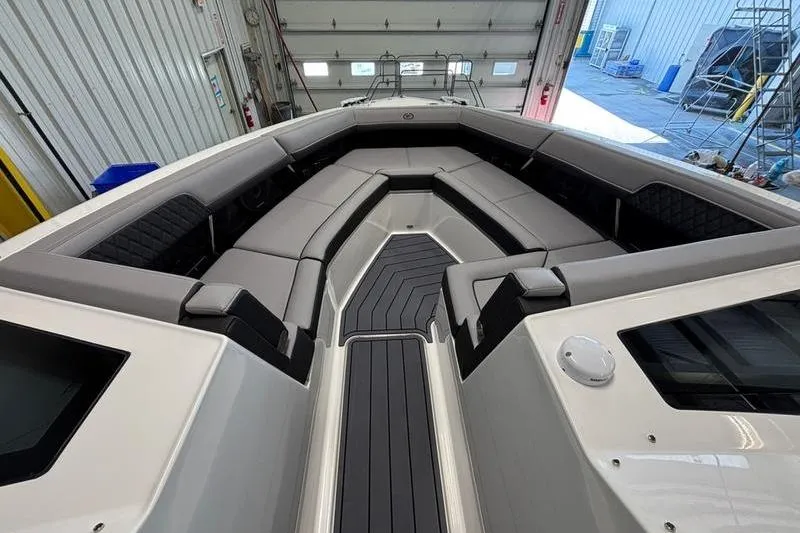 Slide: The Image of 2026 Cobalt R33 boat interior with sleek seating and modern design in a garage setting. - 15