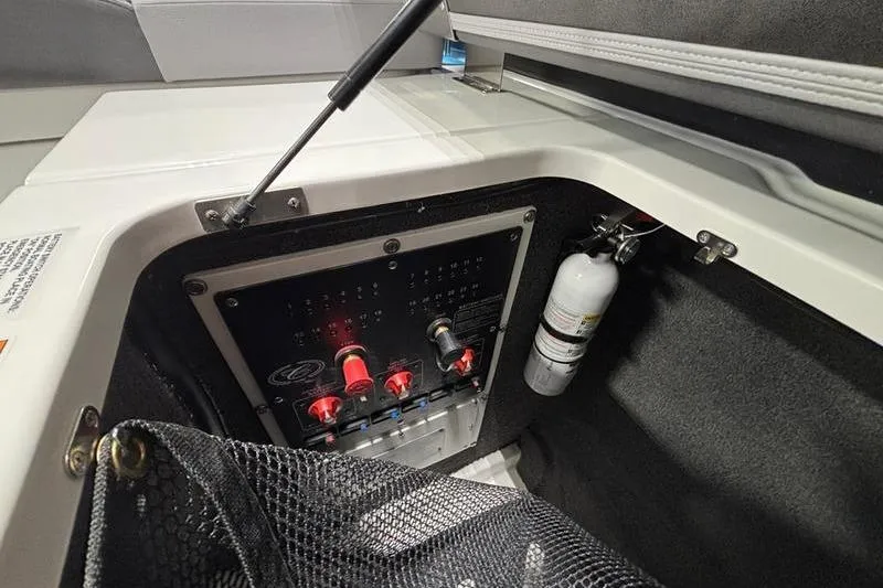 Slide: The Image of 2026 Cobalt R33 boat interior showing control panel and fire extinguisher. - 21