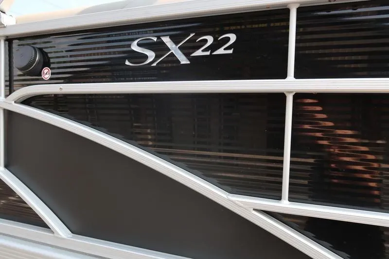 Slide: The Image of 2023 Bennington 22 SXSR boat side panel with SX22 logo detail. - 11