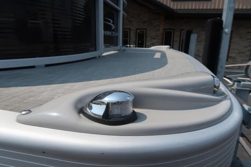Slide: The Image of 2023 Bennington 22 SXSR boat detail with chrome fixture and sleek design. - 12