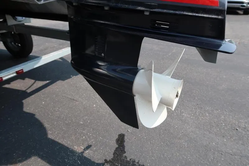 Slide: The Image of 2023 Bennington 22 SXSR boat propeller and motor detail on trailer. - 14