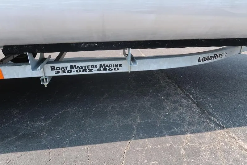 Slide: The Image of 2023 Bennington 22 SXSR boat trailer by LoadRite, featuring Boat Masters Marine contact details. - 18