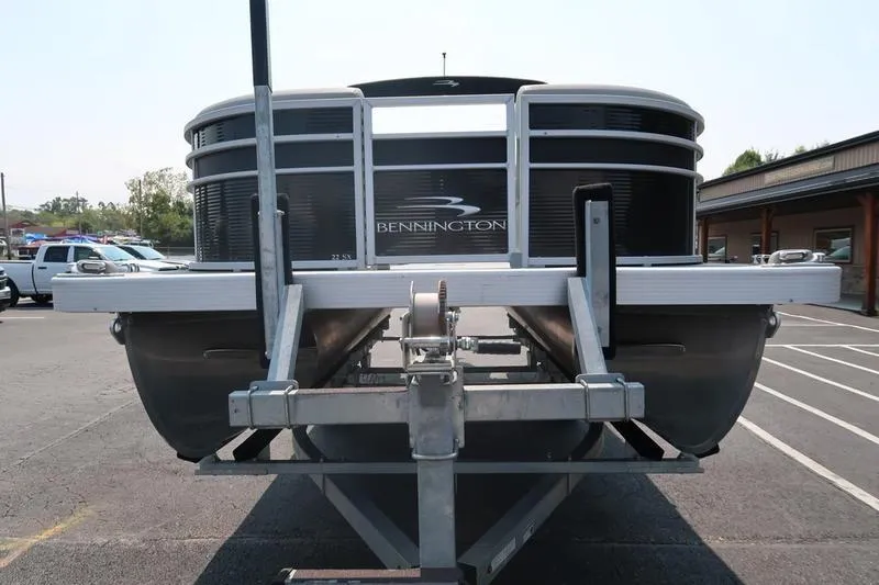 Slide: The Image of 2023 Bennington 22 SXSR pontoon boat on trailer in parking lot. - 3