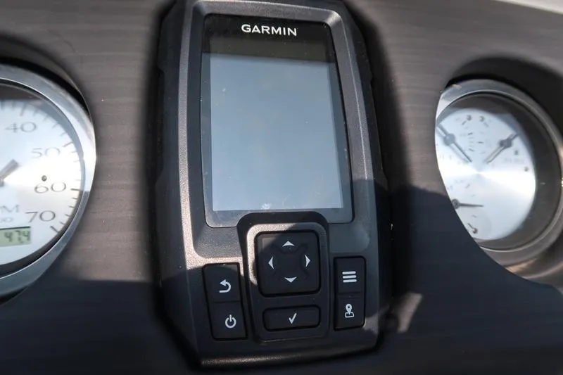 Slide: The Image of Garmin device on 2023 Bennington 22 SXSR dashboard with gauges. - 32