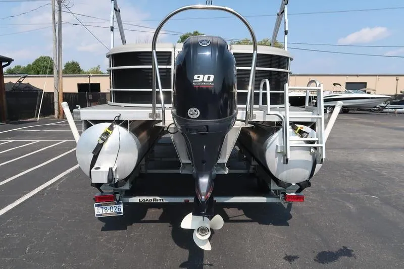 Slide: The Image of 2023 Bennington 22 SXSR pontoon boat with Yamaha 90 horsepower engine, rear view. - 5