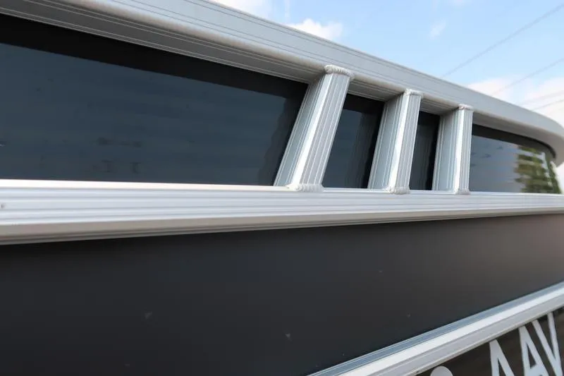 Slide: The Image of Close-up of 2023 Bennington 22 SXSR boat's sleek metallic detailing. - 9