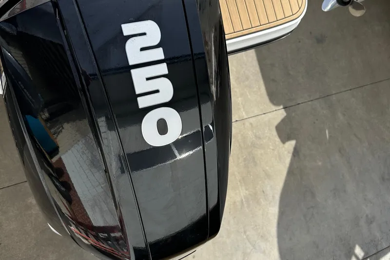 Slide: The Image of Close-up of 2023 Sea Ray SPX 230 Outboard engine with '250' marking. - 12