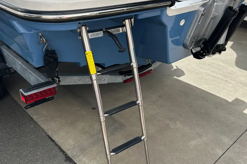 Slide: The Image of 2023 Sea Ray SPX 230 Outboard boat ladder and trailer detail. - 13