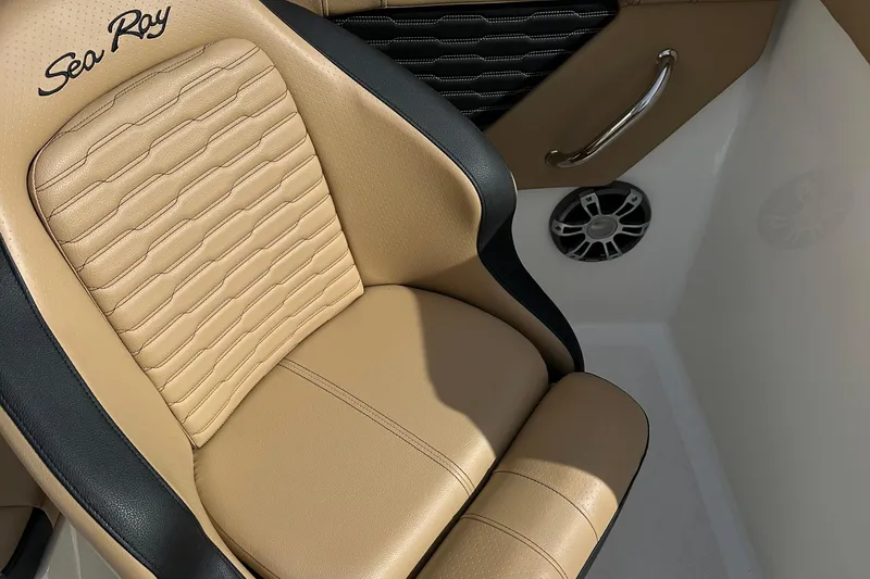 Slide: The Image of Luxurious tan and black seat in 2023 Sea Ray SPX 230 Outboard boat interior. - 7