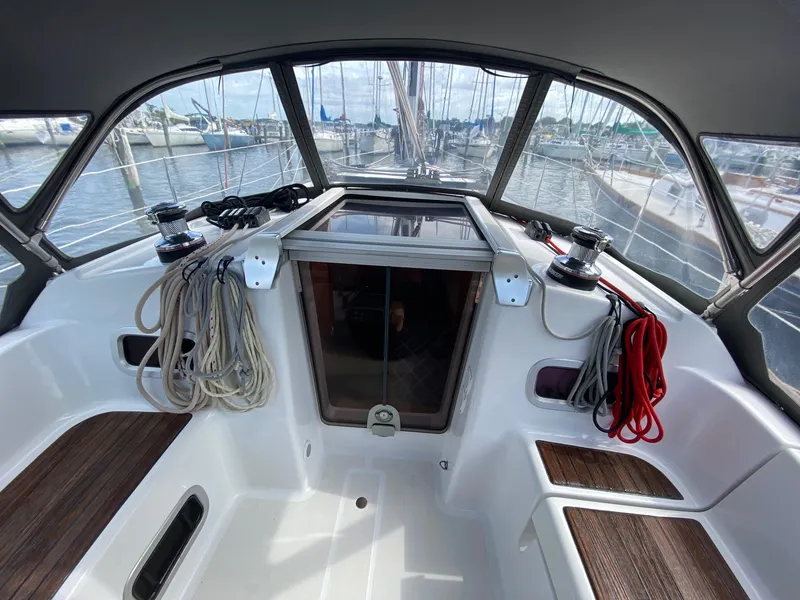Slide: The Image of Cockpit of 2014 Beneteau Oceanis 34 sailboat with ropes and winches, docked at marina. - 33