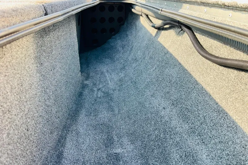 Slide: The Image of Interior view of 2026 Tracker Pro Team 195 boat storage compartment. - 20