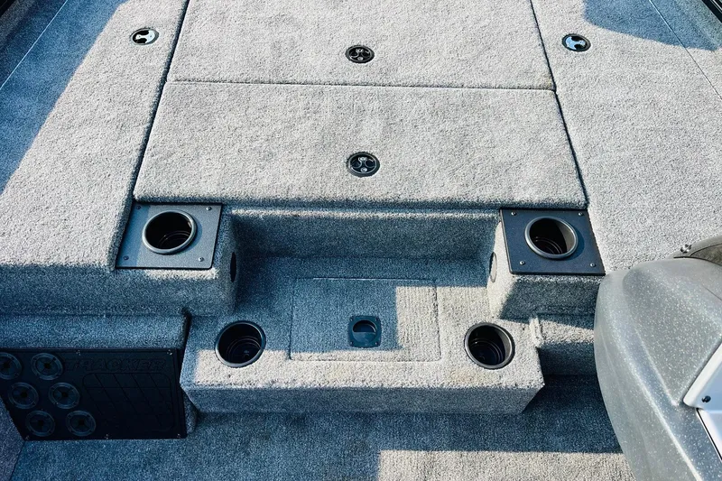Slide: The Image of 2026 Tracker Pro Team 195 boat deck with carpeted surface and cup holders. - 21