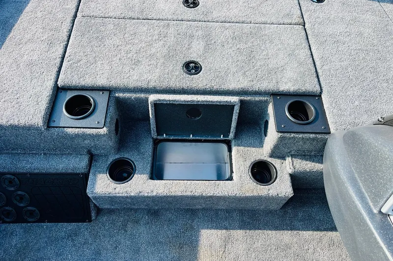 Slide: The Image of 2026 Tracker Pro Team 195 boat interior with storage compartments and cup holders. - 22