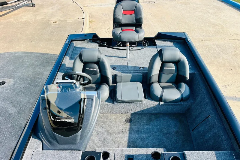 Slide: The Image of 2026 Tracker Pro Team 195 boat interior with seating and steering console. - 24