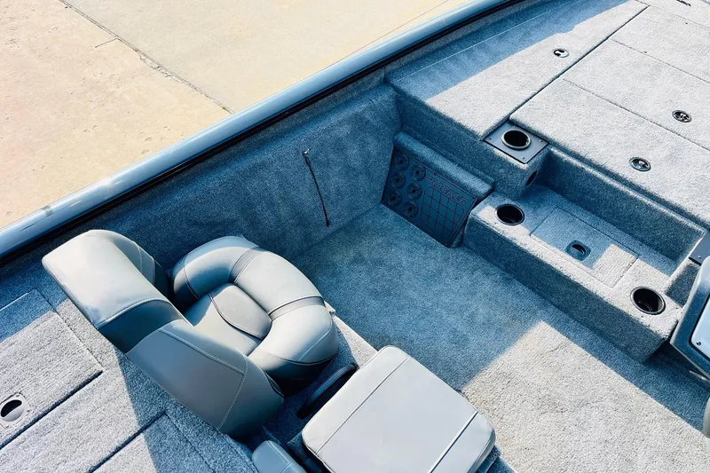 Slide: The Image of Interior of 2026 Tracker Pro Team 195 boat with gray seating and carpeted deck. - 29