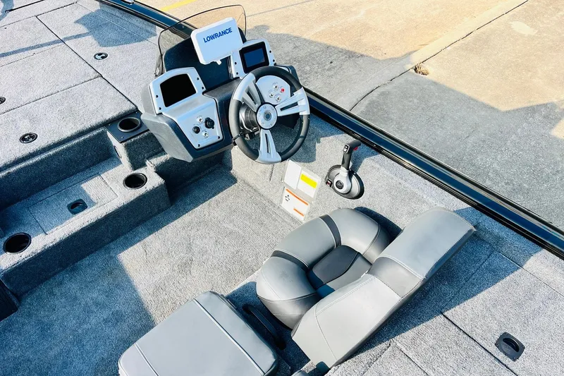 Slide: The Image of 2026 Tracker Pro Team 195 boat interior with steering wheel and control panel. - 30