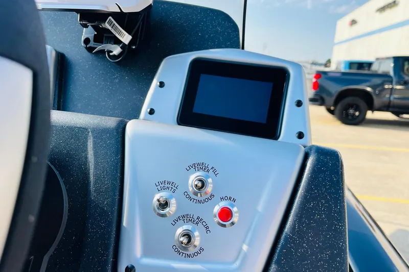 Slide: The Image of Control panel of 2026 Tracker Pro Team 195 boat with buttons and display. - 33