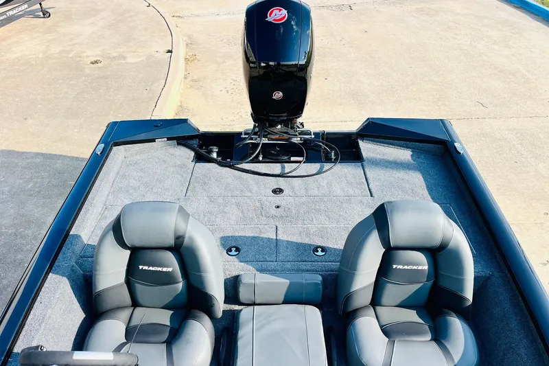 Slide: The Image of 2026 Tracker Pro Team 195 boat interior with two seats and motor. - 35