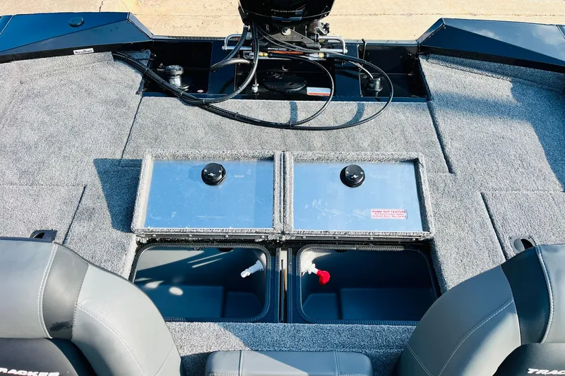 Slide: The Image of 2026 Tracker Pro Team 195 boat interior with storage compartments and seating. - 36