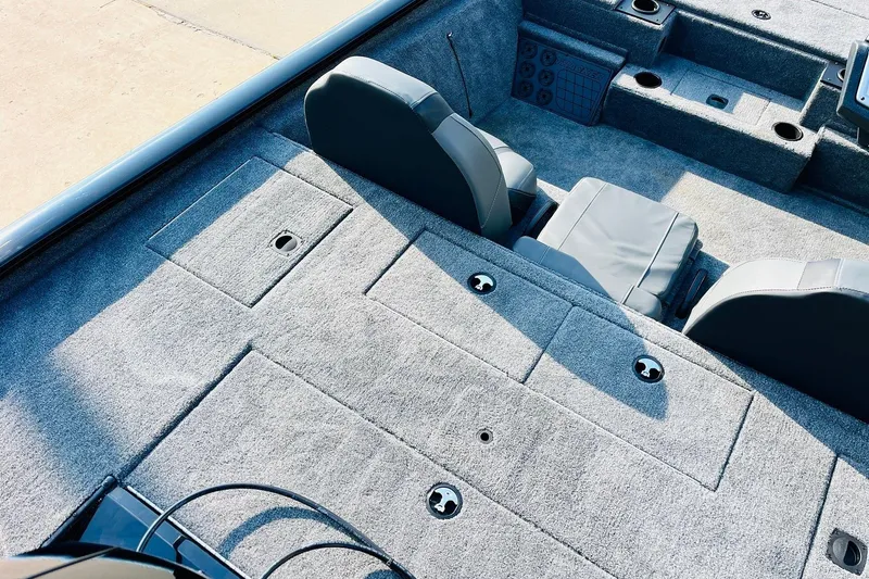 Slide: The Image of 2026 Tracker Pro Team 195 boat interior with gray carpet and seating. - 39