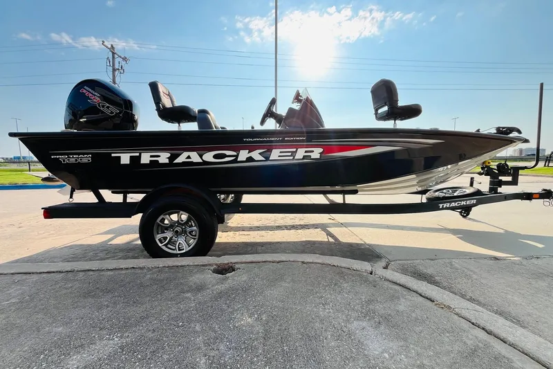 Slide: The Image of 2026 Tracker Pro Team 195 boat on trailer, sunny day, side view. - 4