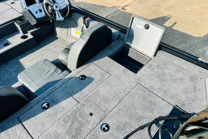 Slide: The Image of 2026 Tracker Pro Team 195 boat interior with gray seating and storage compartments. - 43