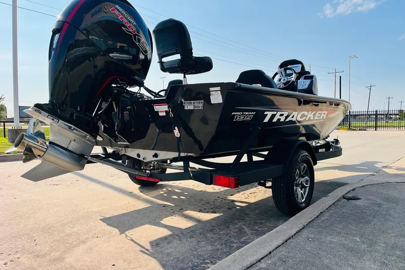 Slide: The Image of 2026 Tracker Pro Team 195 boat on trailer, featuring powerful outboard motor. - 5