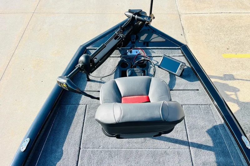 Slide: The Image of 2026 Tracker Pro Team 195 boat deck with seat, trolling motor, and fish finder. - 9