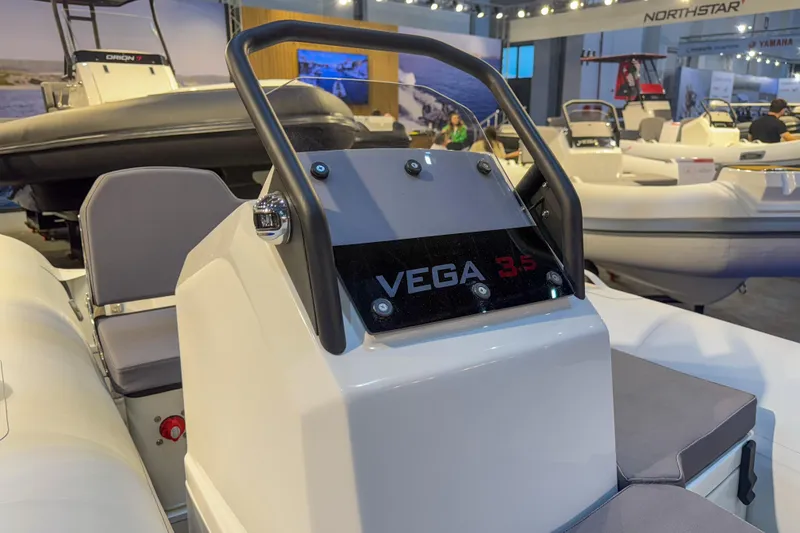 Slide: The Image of 2026 Northstar VEGA 3.5 boat displayed at a marine exhibition. - 2