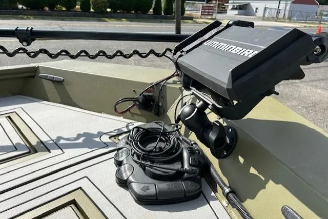 Slide: The Image of 2024 Lund 1660 Predator Tiller boat with Humminbird fish finder and control panel. - 15
