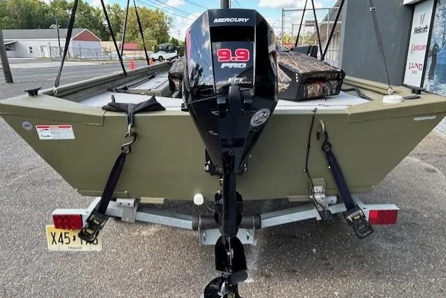 Slide: The Image of 2024 Lund 1660 Predator Tiller boat with Mercury 9.9 Pro motor on trailer. - 7