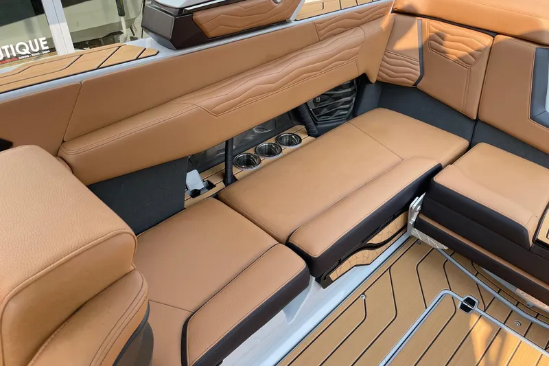 Slide: The Image of Luxurious interior of 2026 Nautique Super Air Nautique G23 with tan leather seating. - 7