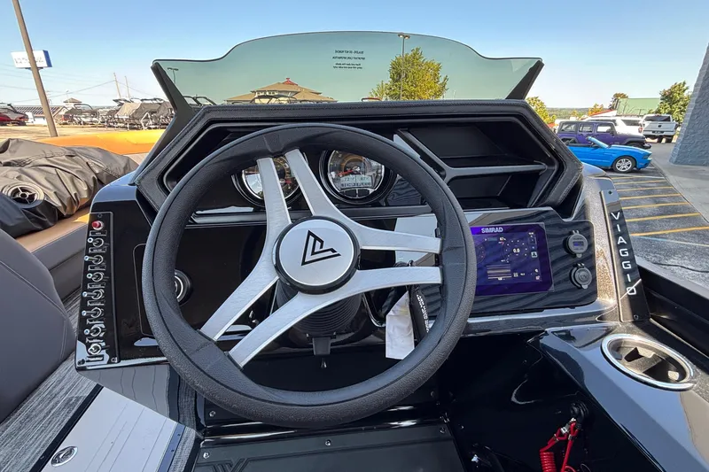 Slide: The Image of Steering wheel and dashboard of 2026 Viaggio Z24U boat with digital display. - 14