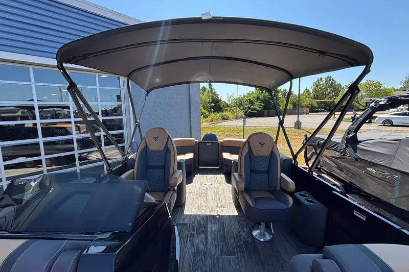 Slide: The Image of 2026 Viaggio Z24U pontoon boat interior with canopy and luxurious seating. - 16