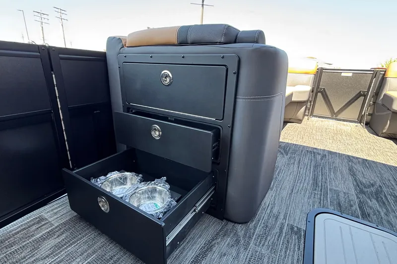 Slide: The Image of Interior of 2026 Viaggio Z24U boat with open storage drawers and carpeted flooring. - 21