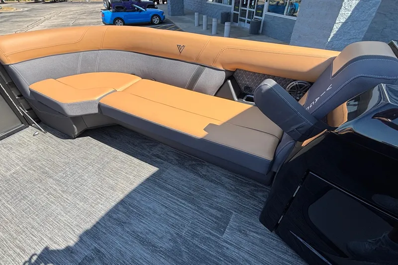 Slide: The Image of Luxurious seating on 2026 Viaggio Z24U boat, featuring tan and gray upholstery. - 24