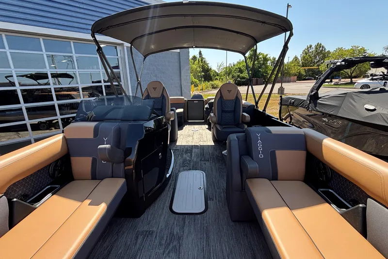 Slide: The Image of Luxurious 2026 Viaggio Z24U pontoon boat interior with tan and gray seating. - 26