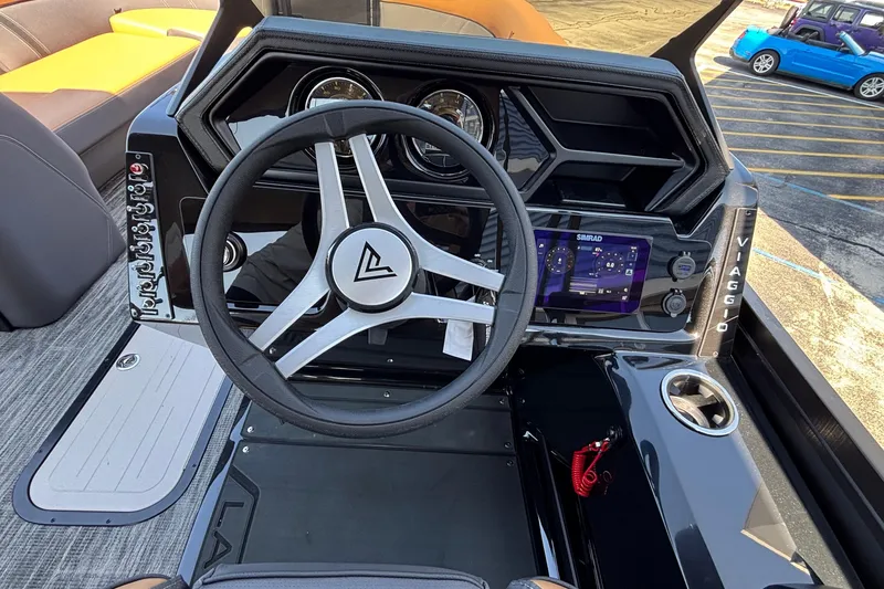 Slide: The Image of Viaggio Z24U 2026 boat dashboard with steering wheel and digital display. - 33