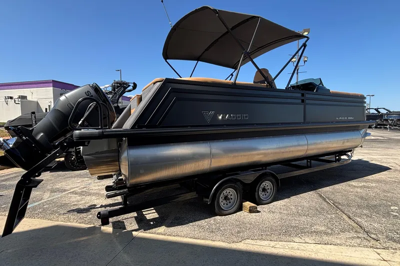 Slide: The Image of 2026 Viaggio Z24U pontoon boat on trailer, featuring sleek design and modern outboard motor. - 4