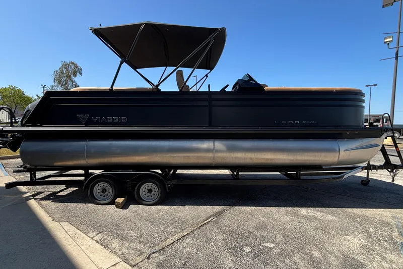 Slide: The Image of 2026 Viaggio Z24U pontoon boat on trailer under clear blue sky. - 5