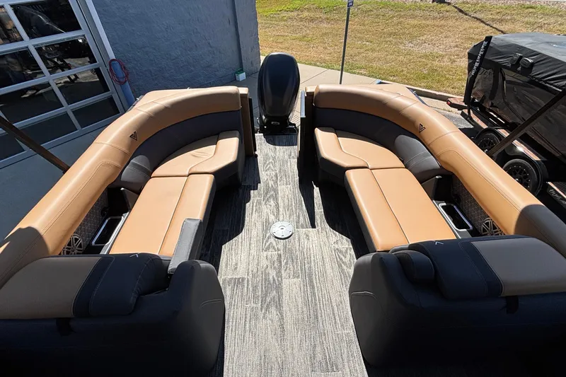Slide: The Image of 2026 Viaggio Z24U boat interior with tan and gray seating, outdoor setting. - 6