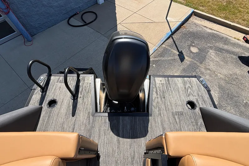 Slide: The Image of Rear view of 2026 Viaggio Z24U boat with seating and motor, parked on pavement. - 7