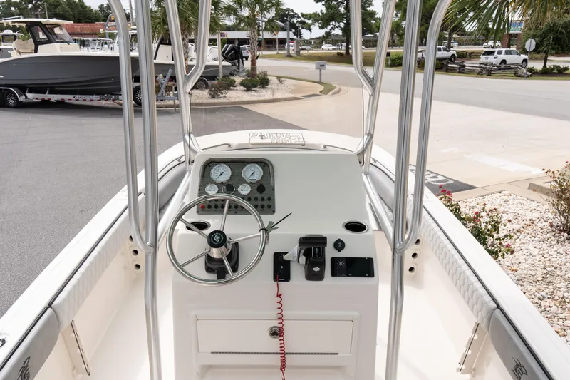 Slide: The Image of 2026 Carolina Skiff 21 Ultra Elite boat console with steering wheel and gauges. - 10