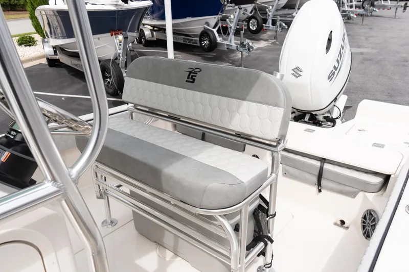 Slide: The Image of 2026 Carolina Skiff 21 Ultra Elite boat interior with seating and Suzuki outboard motor. - 12