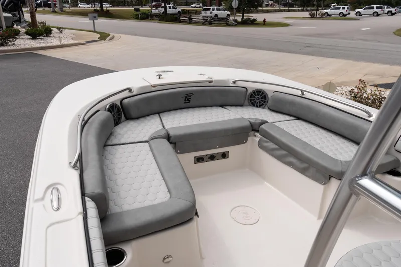 Slide: The Image of 2026 Carolina Skiff 21 Ultra Elite boat interior with gray cushioned seating. - 13