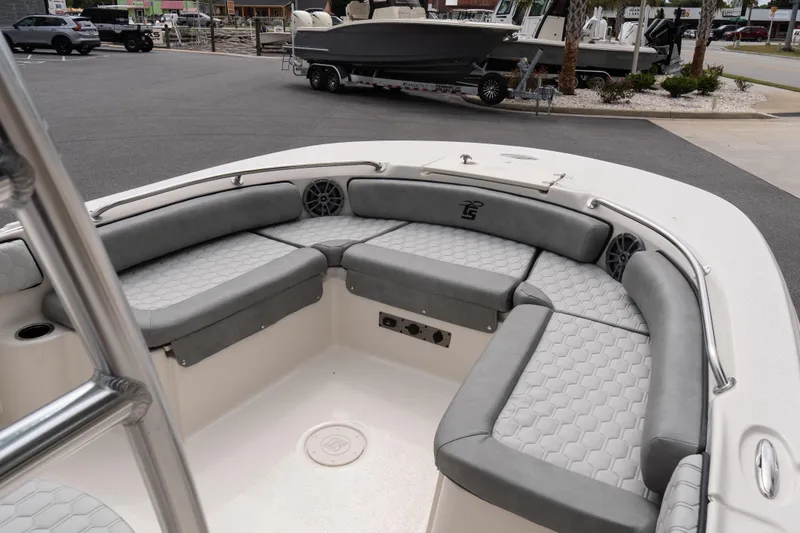Slide: The Image of 2026 Carolina Skiff 21 Ultra Elite boat with gray seating and modern design. - 14